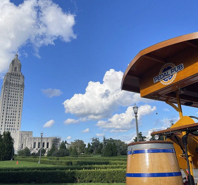 Pedal Pub party bike in front of Capitol Building in Baton Rouge