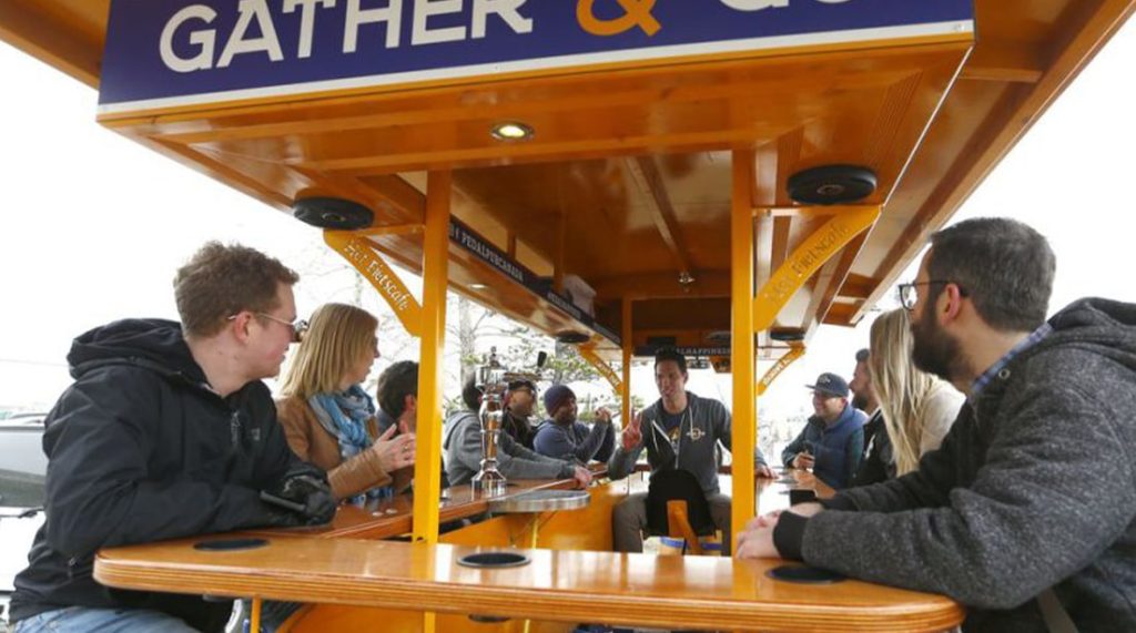 patrons drink on the 15-person Dutch party bike