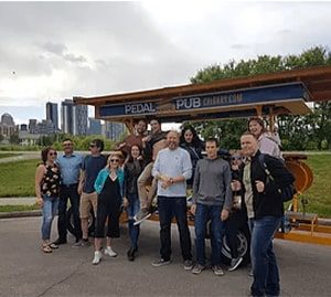 guests in front of Pedal Pub