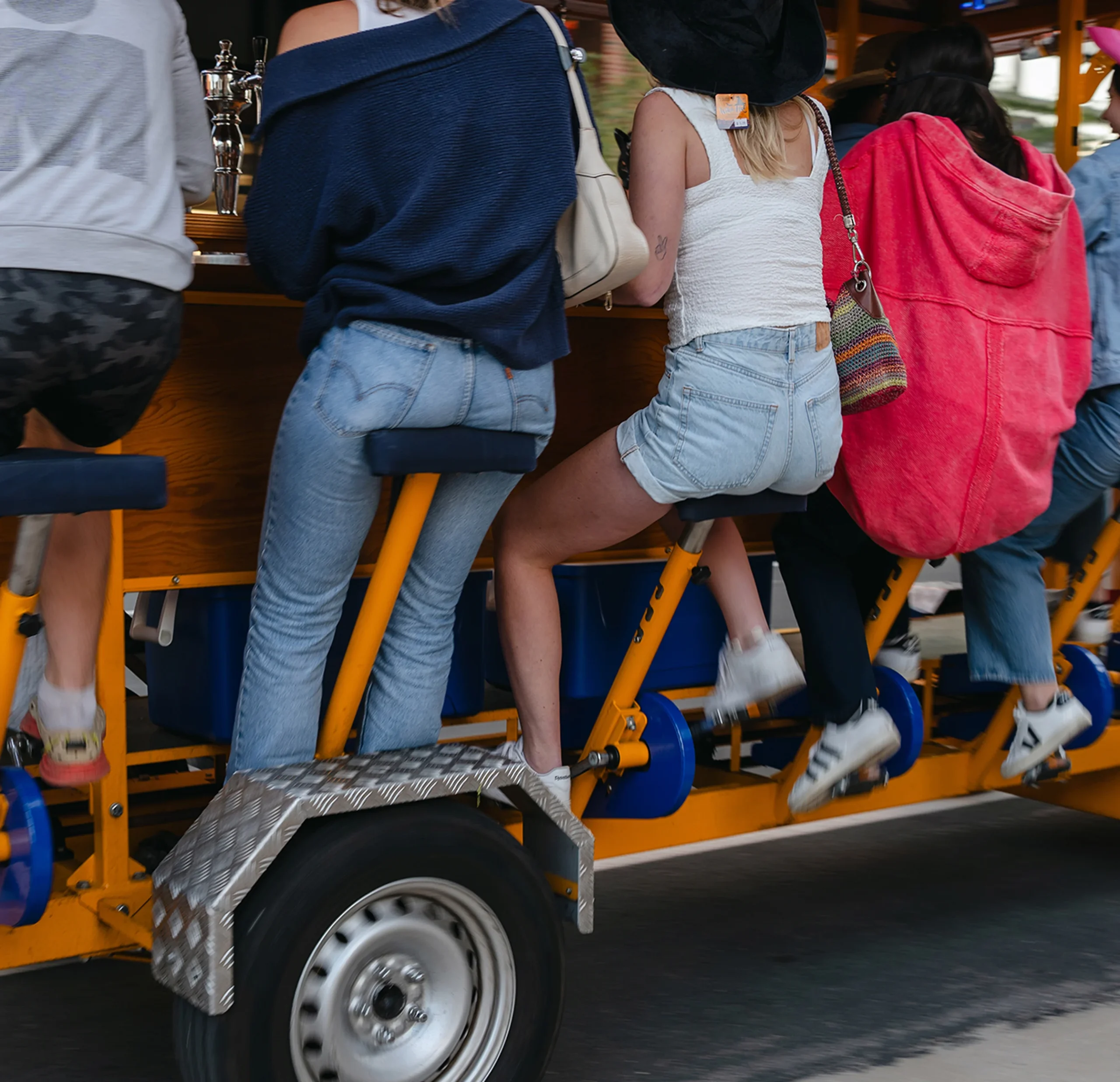 friends pedaling party bike
