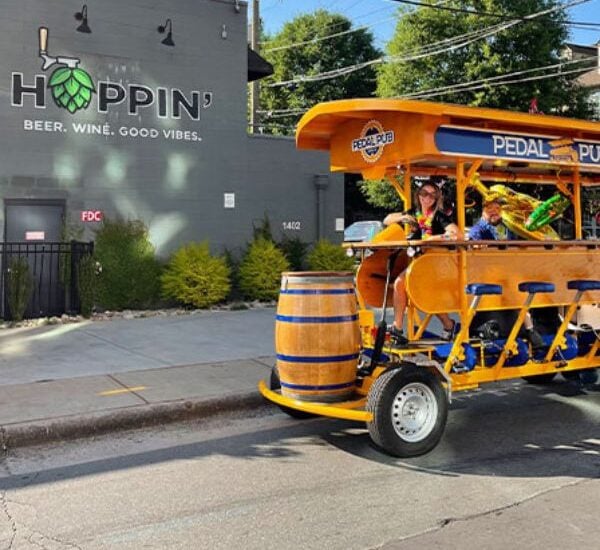 party bike parked in front of Hoppin' Brewery in Charlotte, NC