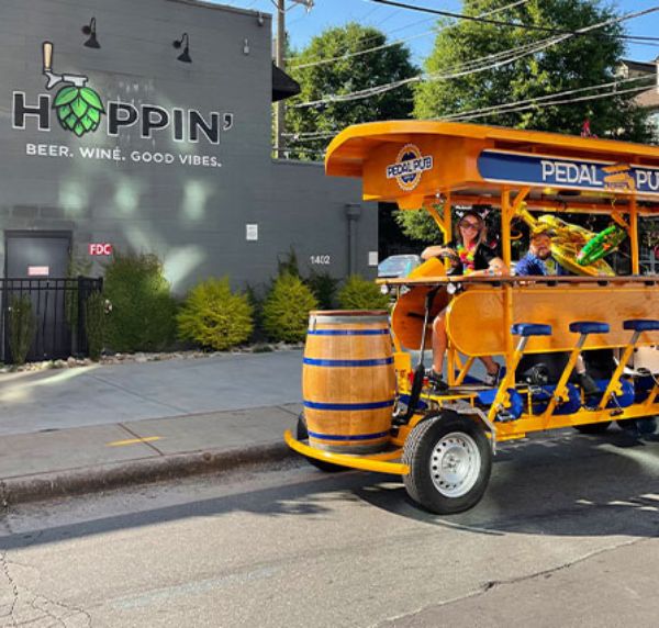 party bike parked in front of Hoppin' Brewery in Charlotte, NC