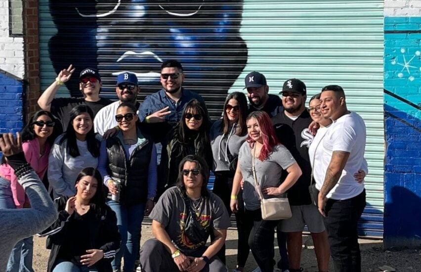 friends in front of mural on deep ellum tour