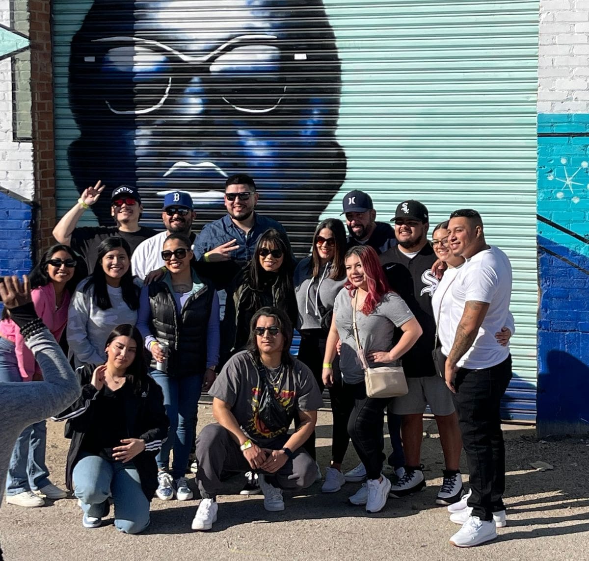friends in front of mural on deep ellum tour