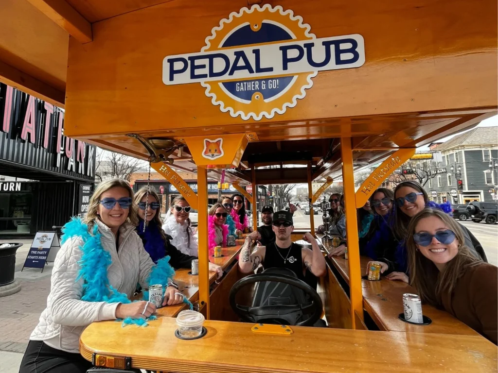 friends sitting on Pedal Pub bike
