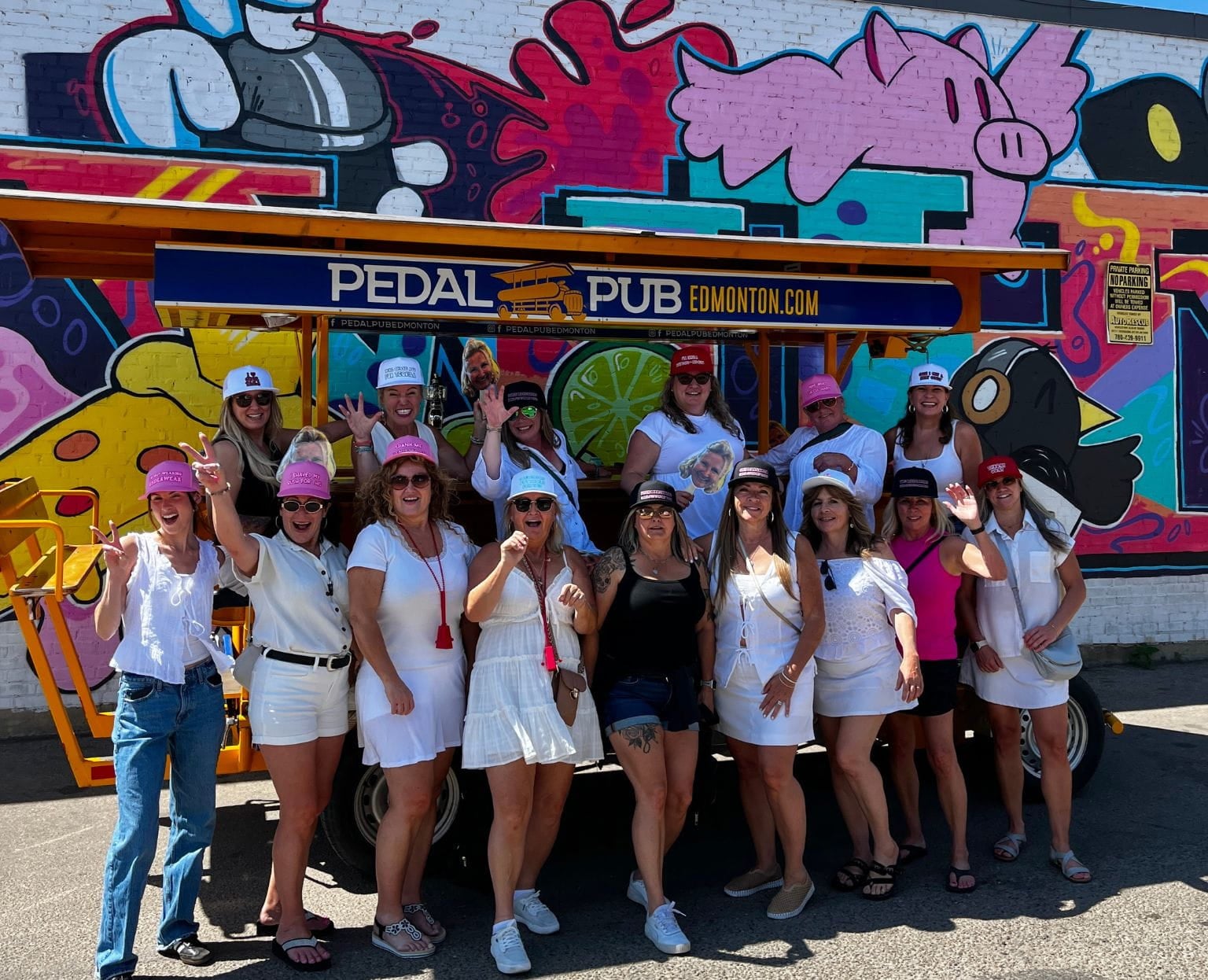 friends in matching outfits posing with Pedal Pub bike