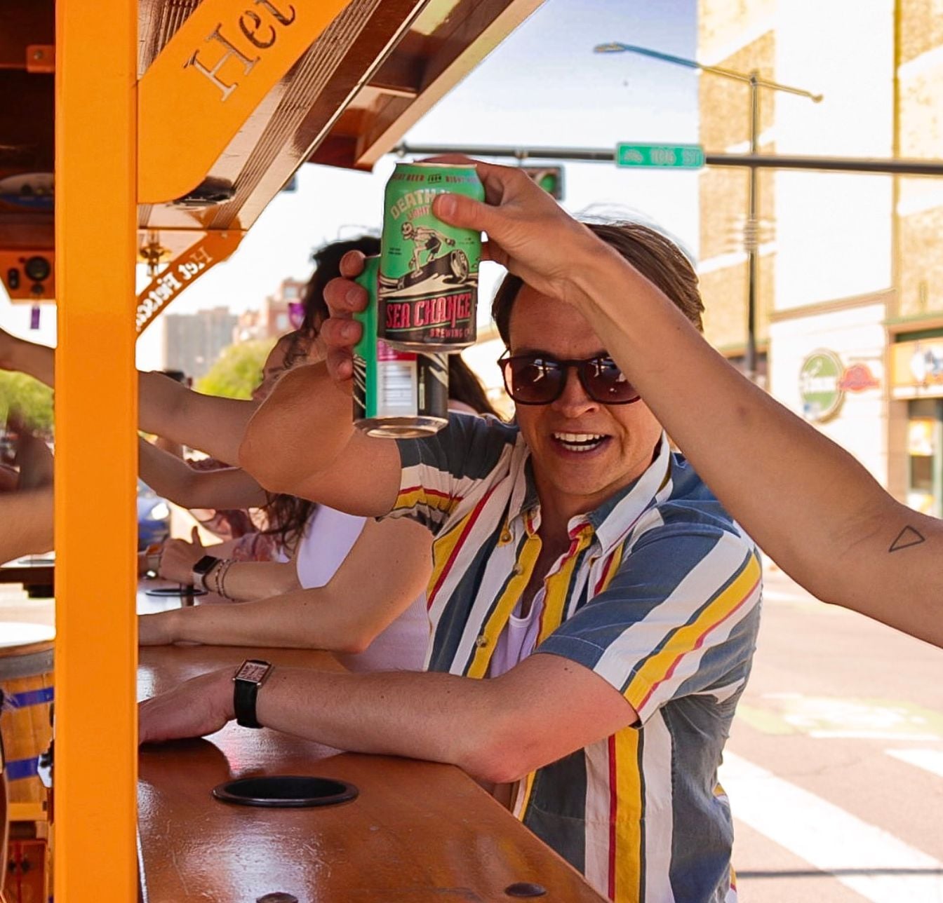 friends cheersing on pedal pub edmonton bike