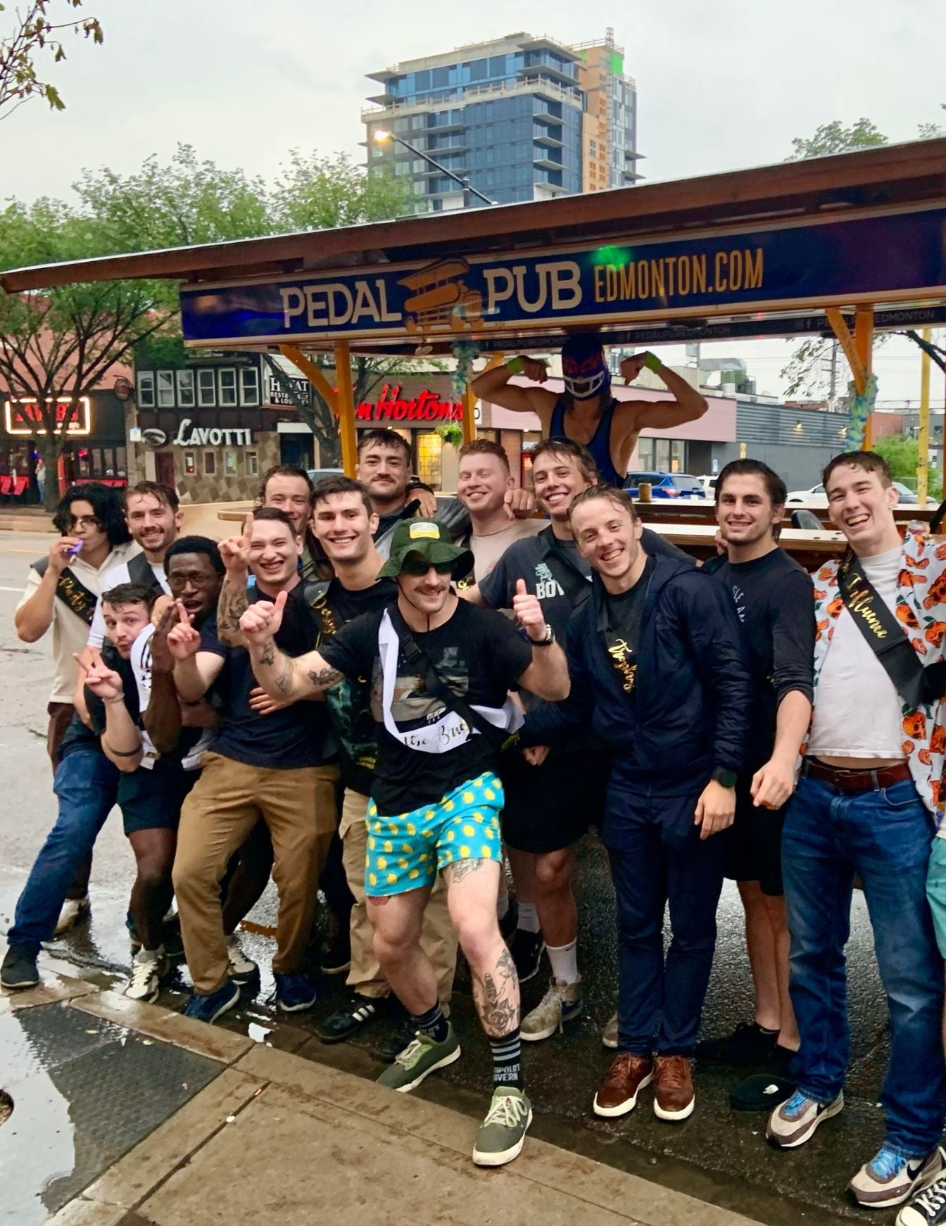 bachelor party in Edmonton in front of party bike