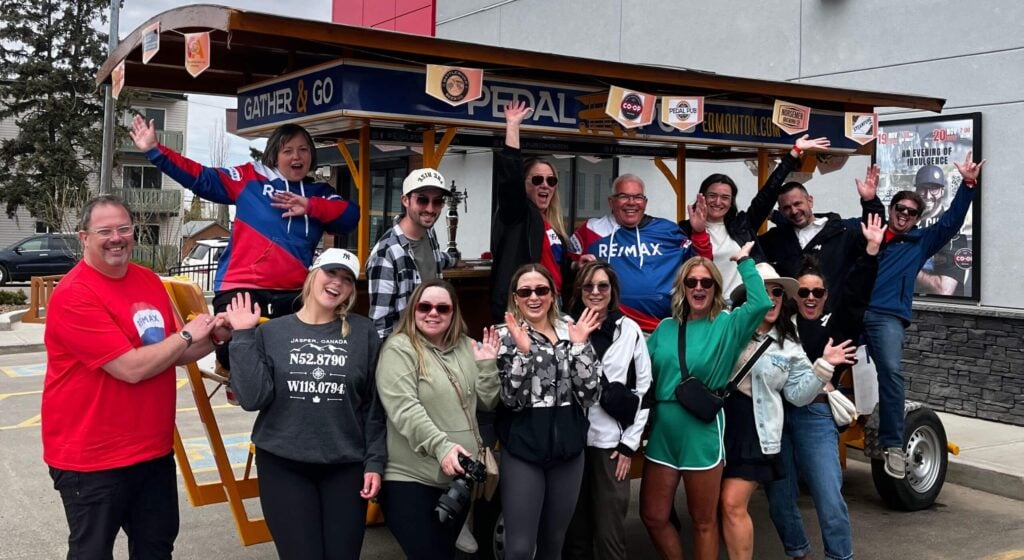 Group poses on the Pedal Pub bike
