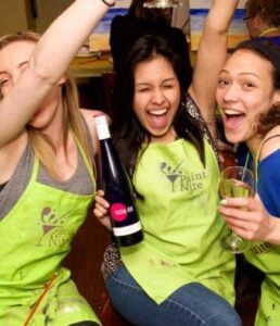 Three girls celebrating at Paint Night