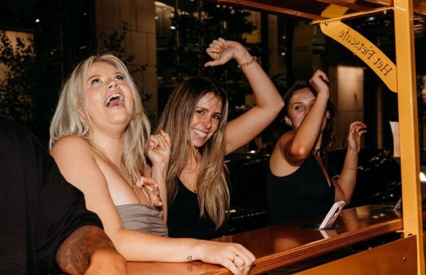women dancing on party bike