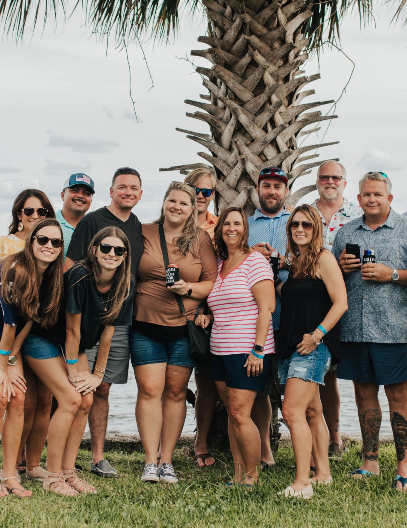 friends in front of palm tree