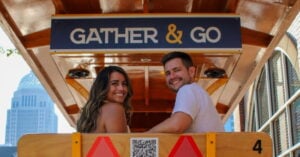couple sitting on party bike
