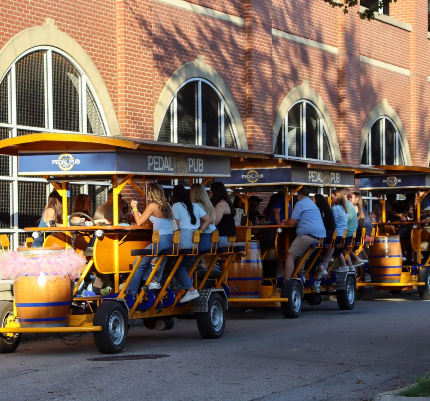 Pedal Pub bikes parked next to eachother with guests