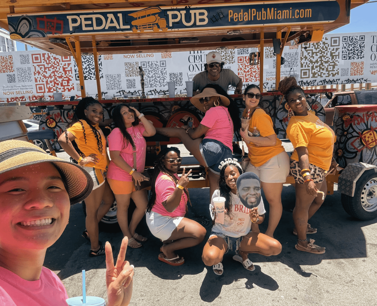 bachelorette party in front of party bus