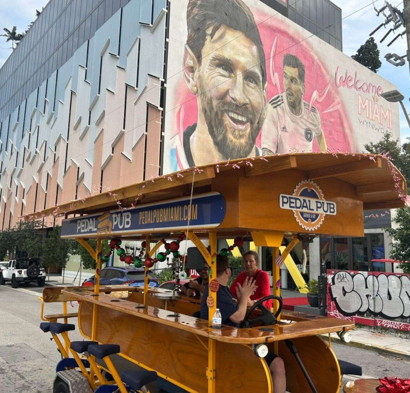Miami party bike in front of Wynwood mural