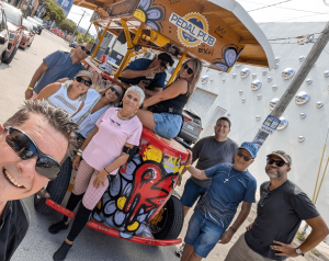 group photo in front of party bike