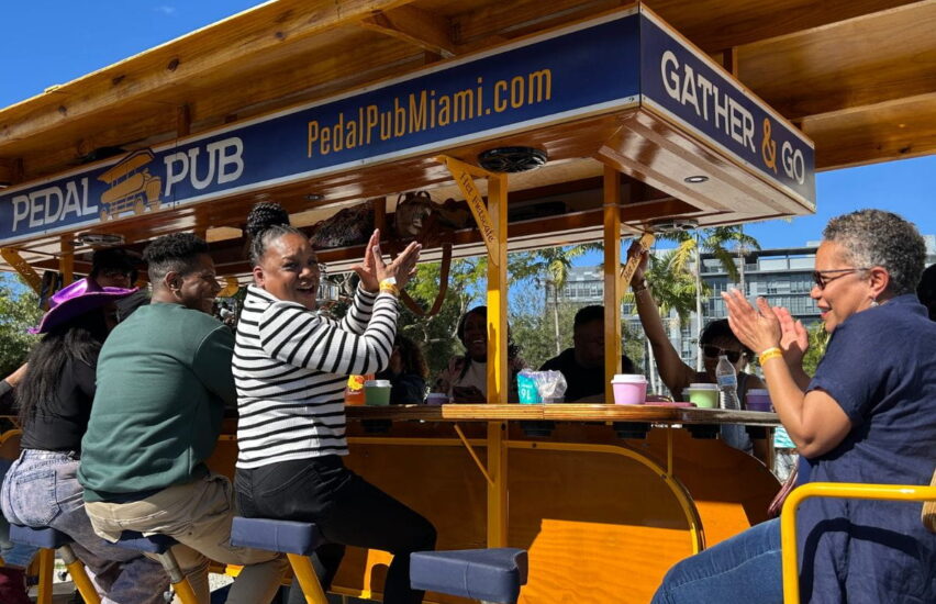 passengers clapping on party bike