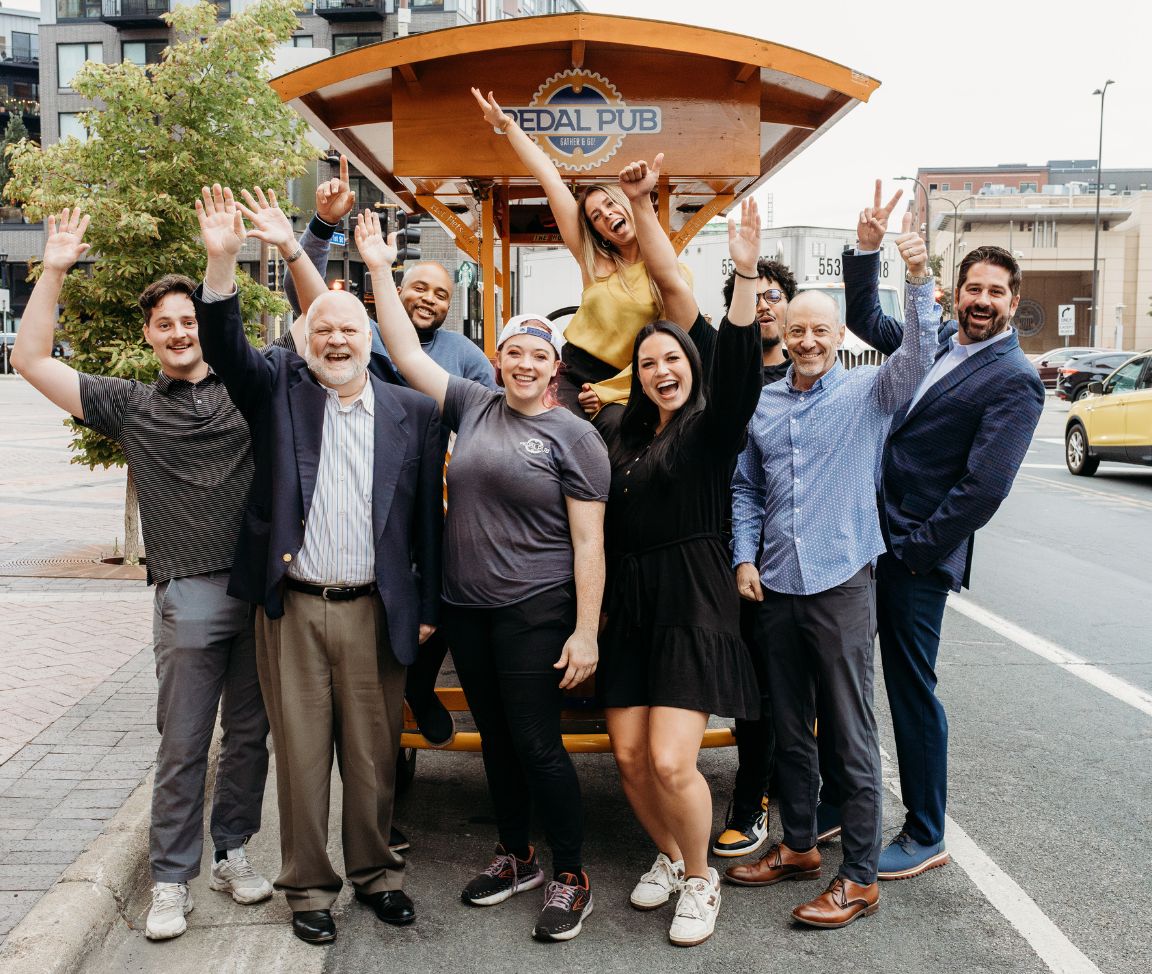 employees in front of party bike