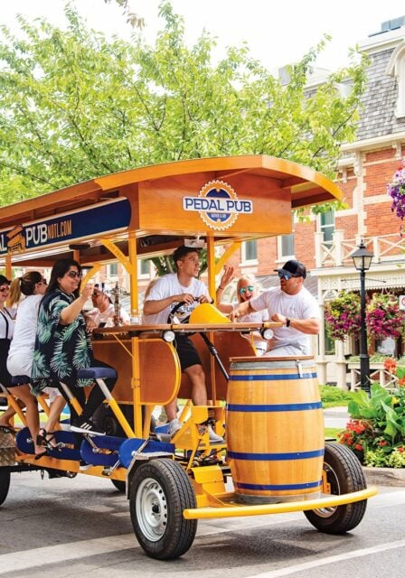 Pedal Pub party bike ride down Queen's Street in NOTL
