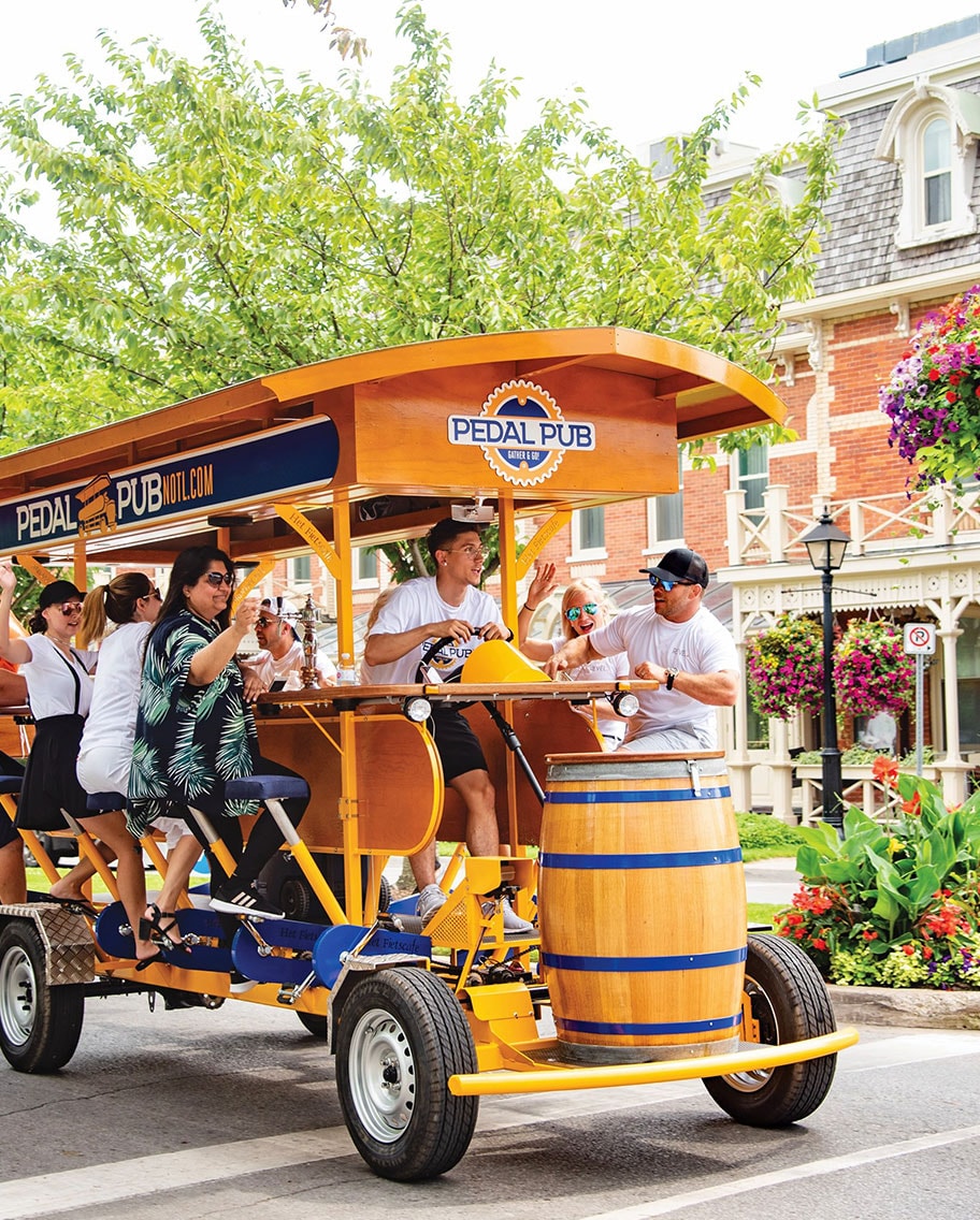 Pedal Pub party bike ride down Queen's Street in NOTL