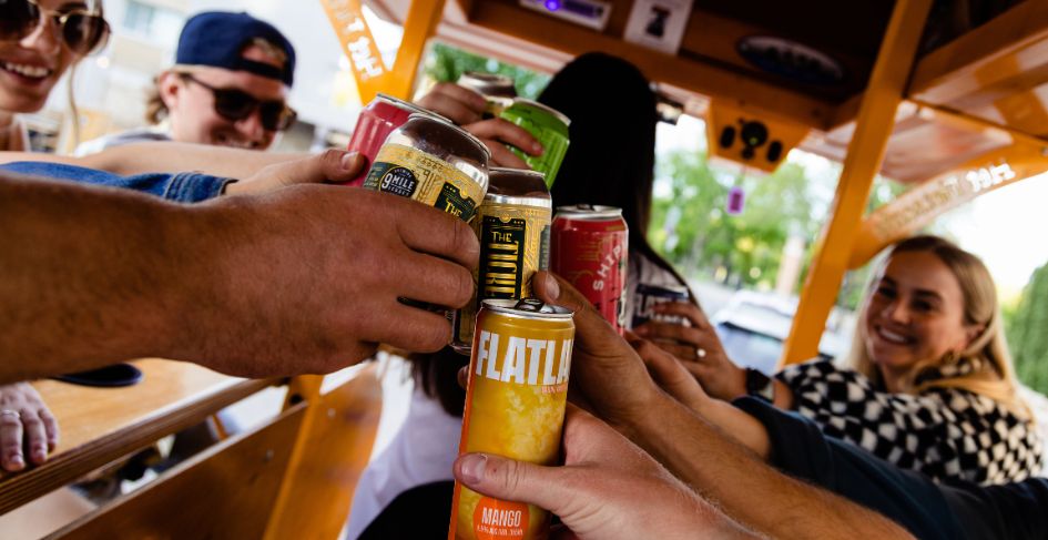 close-up of beer cans cheering