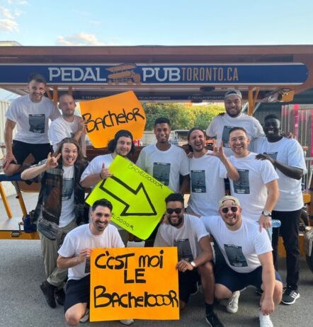bachelor party in toronto in front of party bike