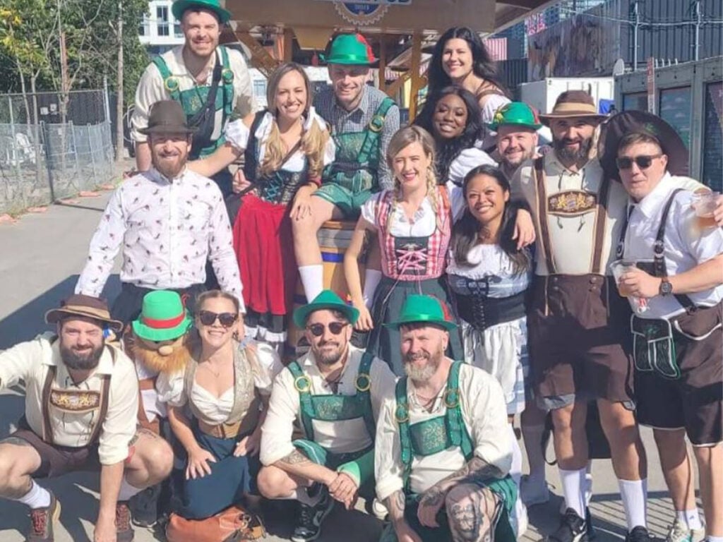 a birthday party dressed in Irish costumes and gathered around a party bike