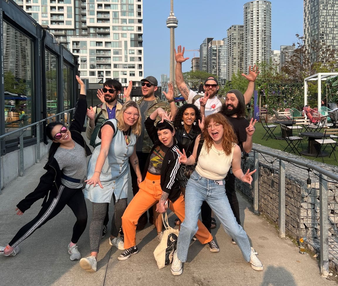 friends posing in front of Toronto skyline