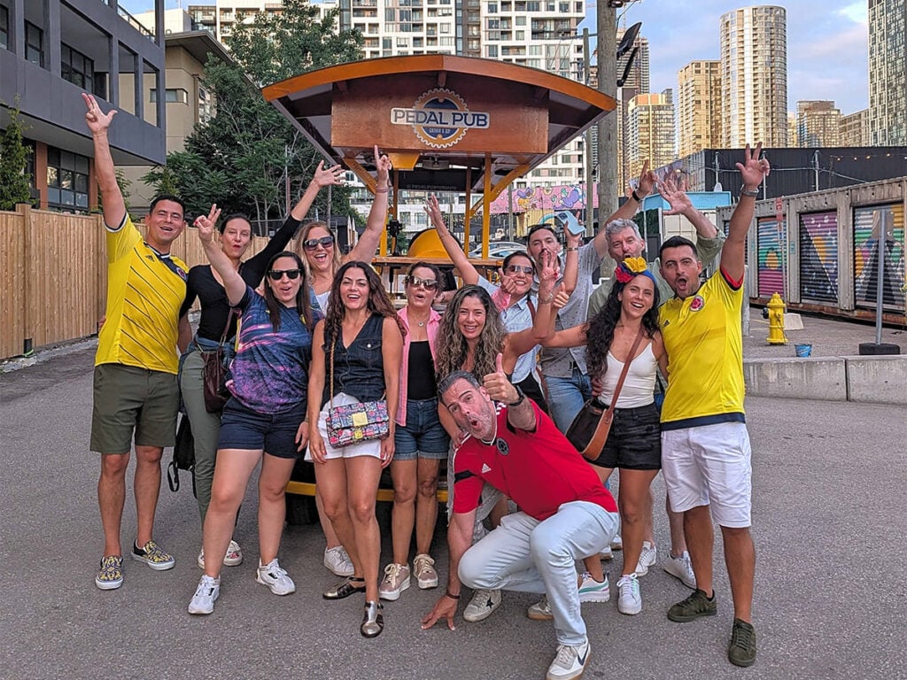 friends celebrating around a party bike