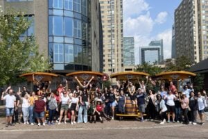 team posing with Pedal Pub bikes