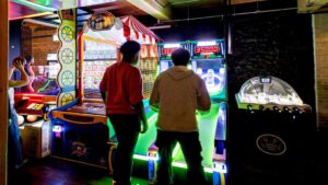 friends playing arcade games