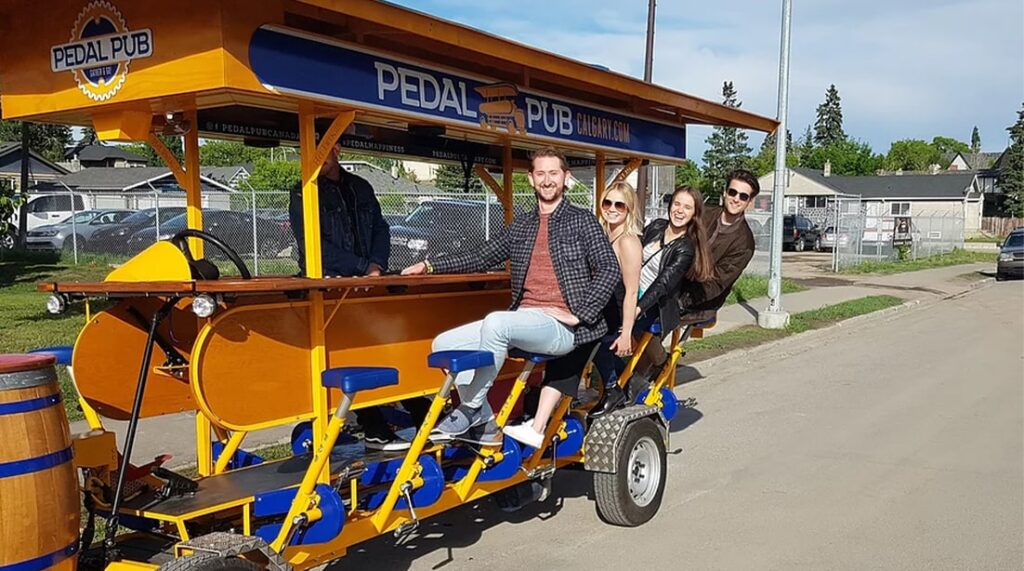 Pedal Pub Calgary guests on bike
