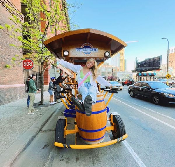 rider on top of Pedal Pub bike in Minneapolis
