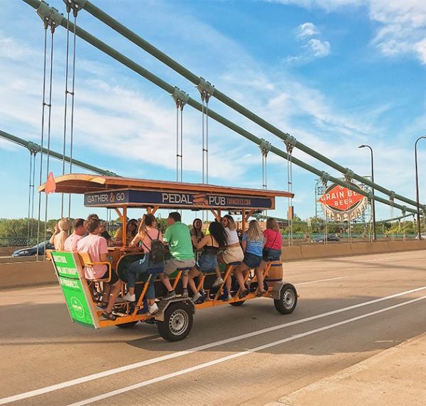 riders sightseeing in Minneapolis on Pedal Pub party bike tour