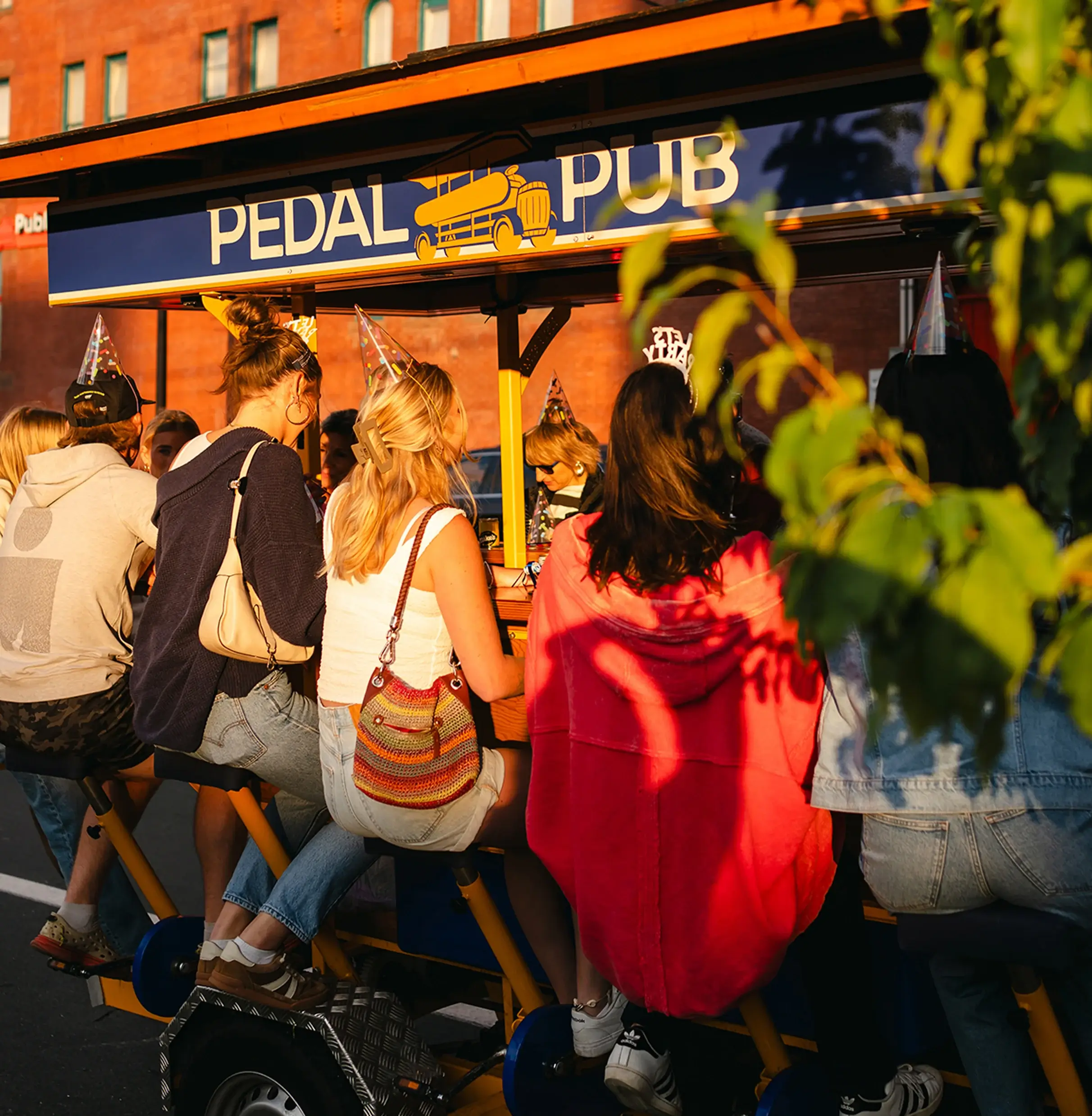 guests sitting on party bike