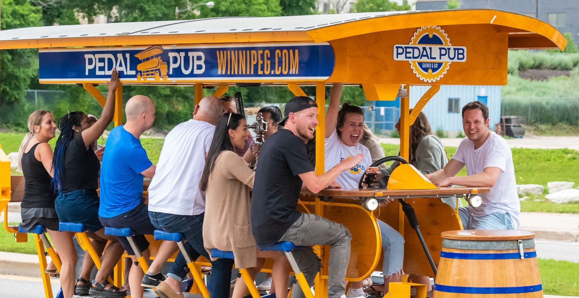 close-up of group of friends on pedal pub bike smiling