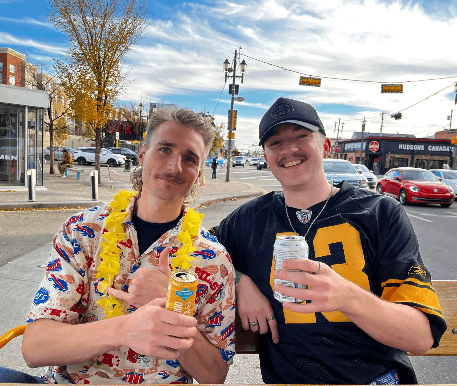 Men posing together with drinks