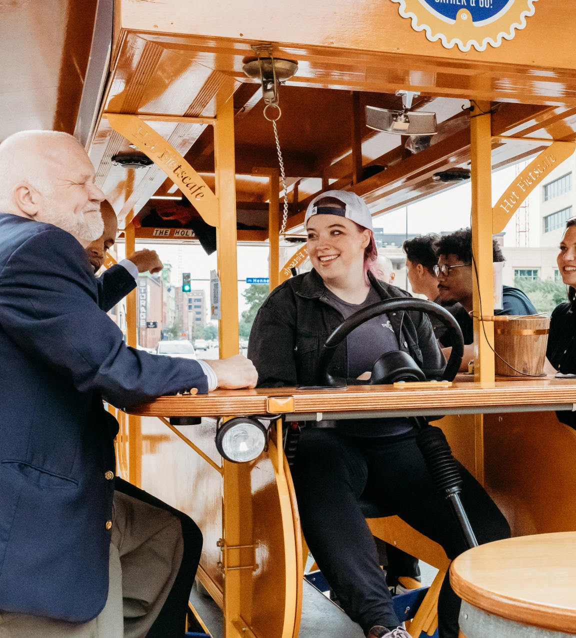 employees on Pedal Pub for company outing