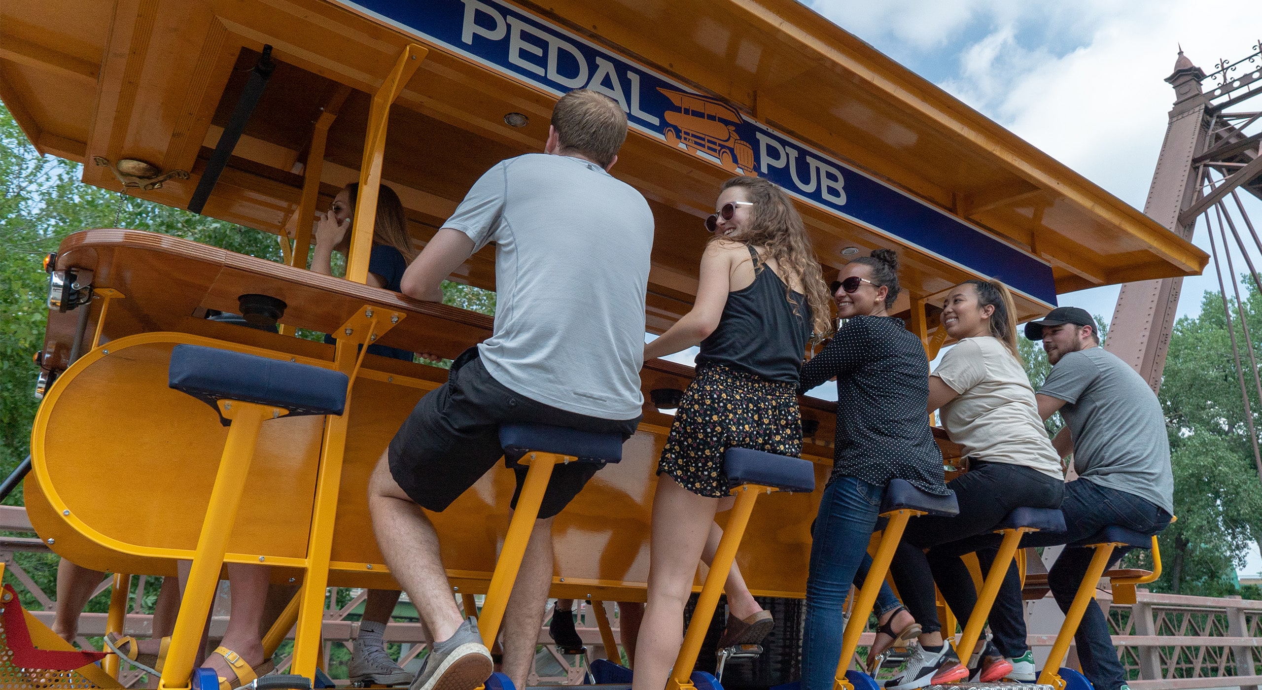 riders pedaling on party bike