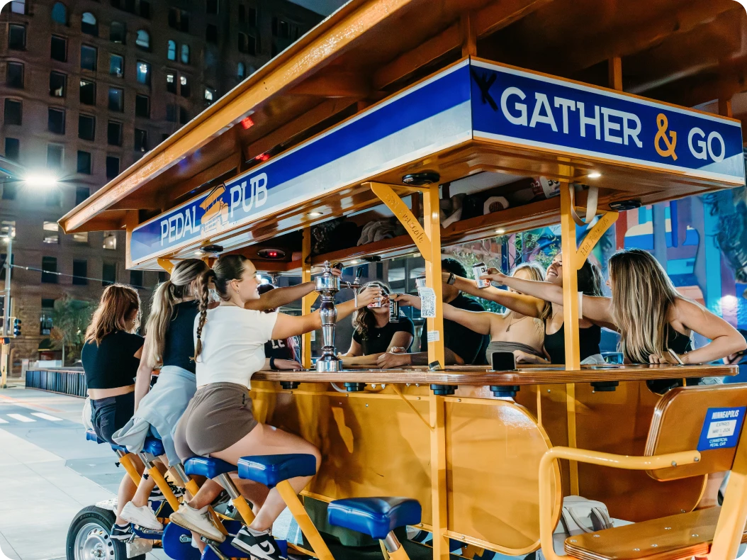 friends cheersing each other on Pedal Pub