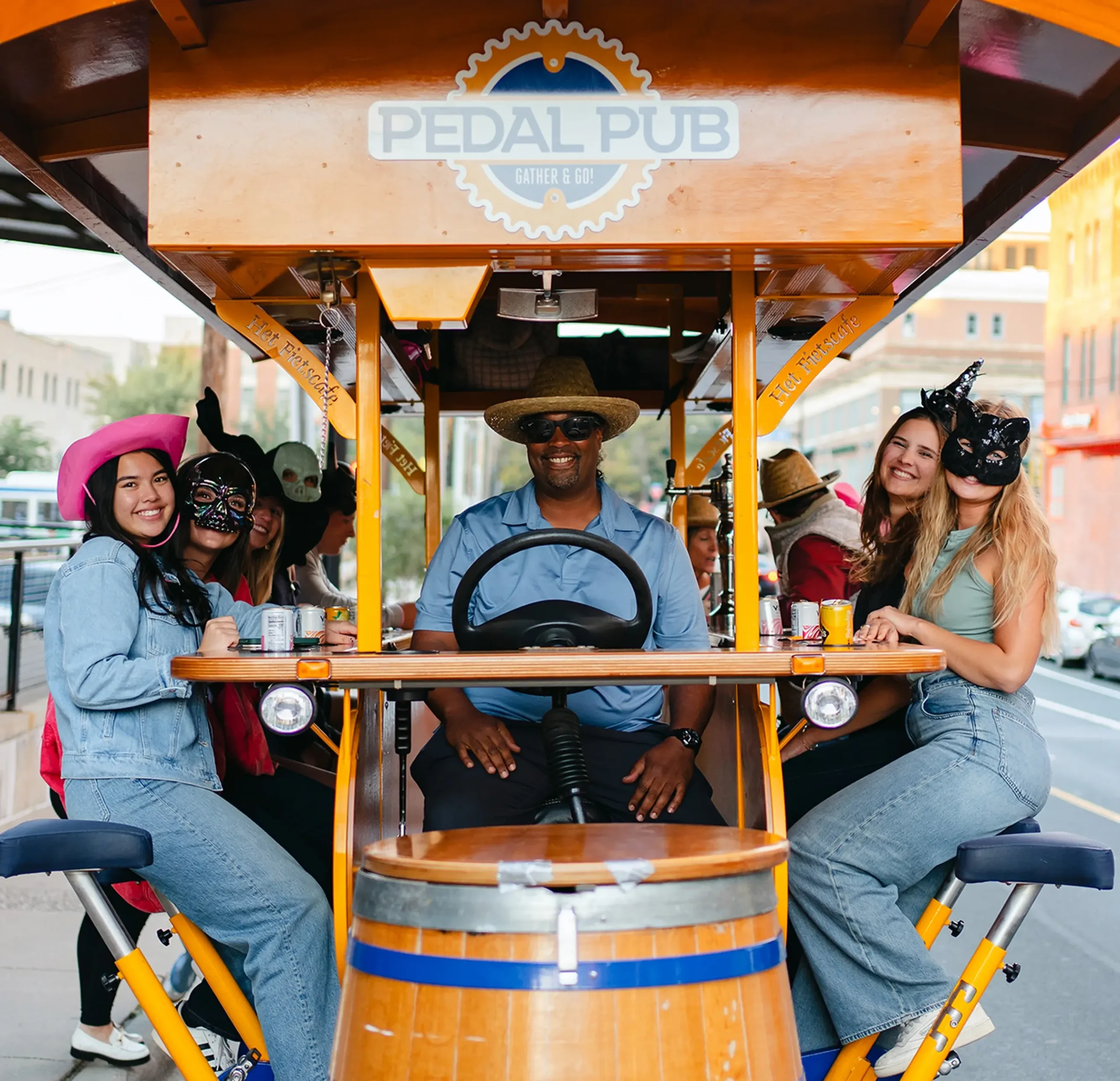 group of friends on party bike in costumes